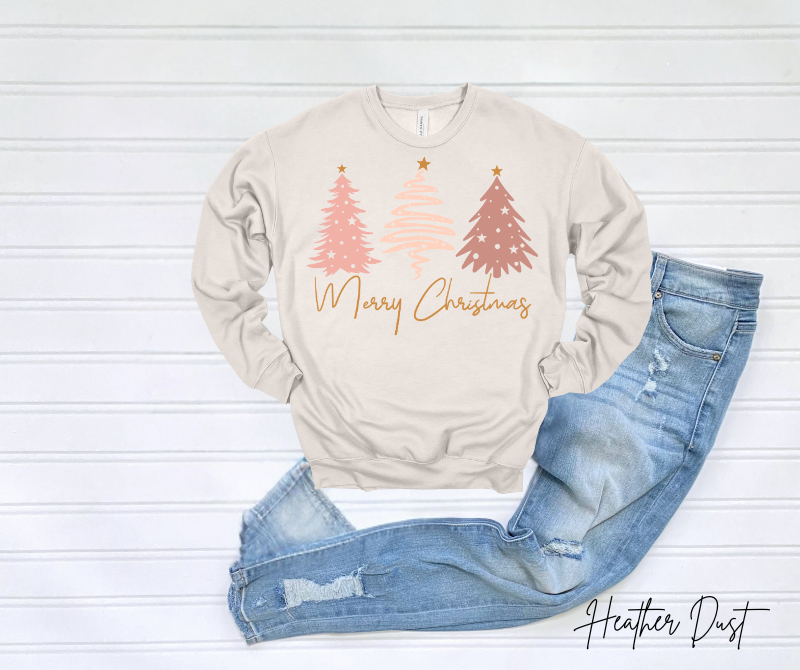 Merry Christmas Sweatshirt with festive tree design and jeans on a white background.