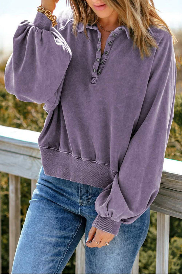 Acid wash quarter-snap collared sweatshirt with lantern sleeves.