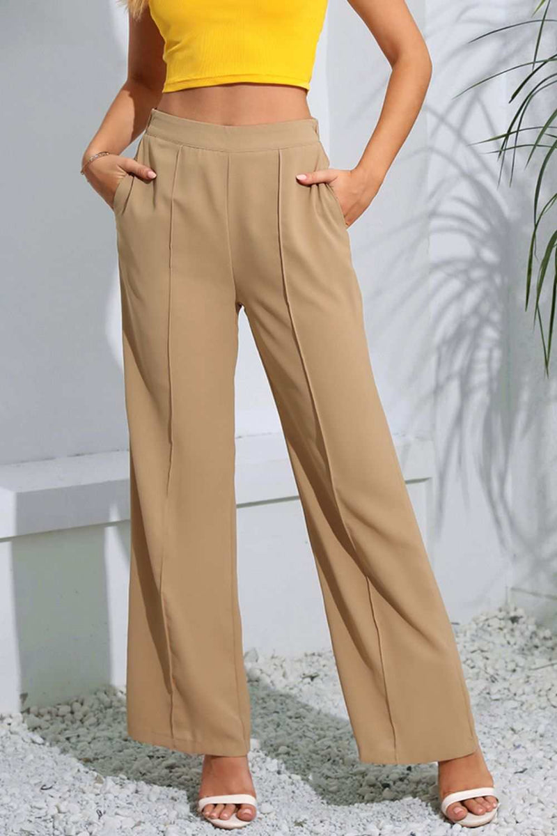 Chic solid long pants with pockets made of 100% polyester.