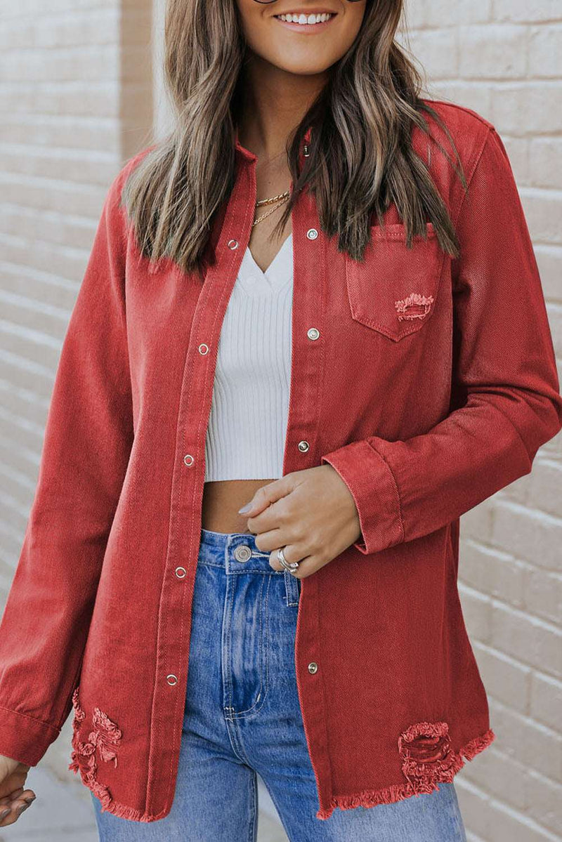 Distressed raw hem snap down denim jacket in red, 100% cotton.